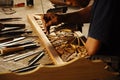 Skilled craftsman doing wood carving using traditional method